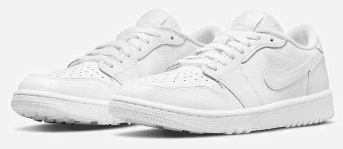 Side view of white Air Jordan golf shoes.